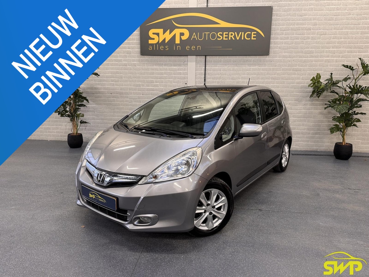 Honda Jazz - 1.4 Hybrid Elegance | Pano | Cruise | Fietsenrek voor auto | All-season banden - AutoWereld.nl