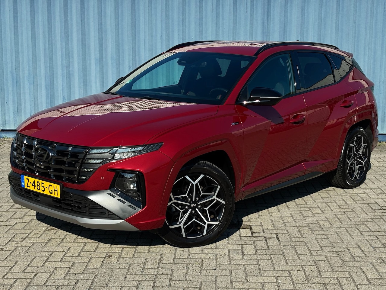 Hyundai Tucson - 1.6 T-GDI PHEV N Line 4WD Sunset Red | Elektrische verstelbare stoelen | Apple carplay | C - AutoWereld.nl