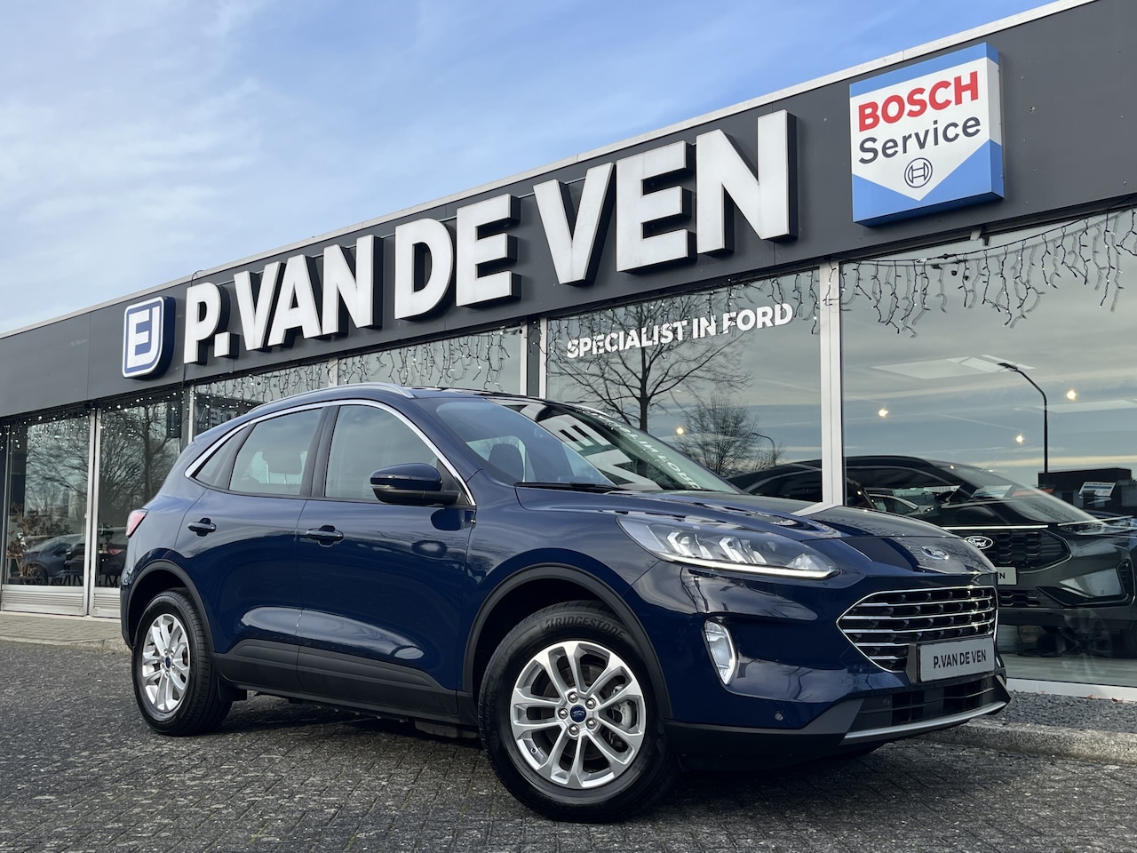 Ford Kuga - 2.5 PHEV Titanium 225pk/165kW e-CVT Automaat | Koplampsproeiers | Winter Pack | - AutoWereld.nl