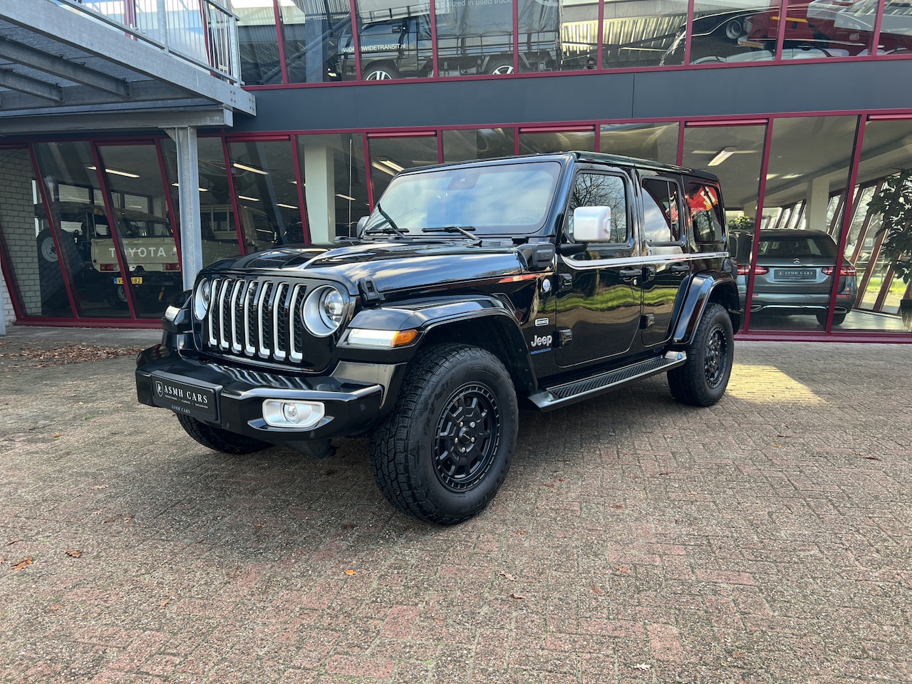 Jeep Wrangler Unlimited - 4xe 380 Sahara | Irmscher | Cross | Camera voor | - AutoWereld.nl