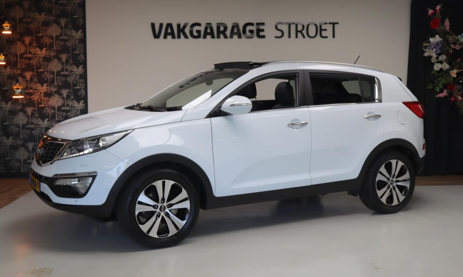 Kia Sportage - 2.0 Super P.| leer | navi | cam | climate | pano | oh.bkje - AutoWereld.nl