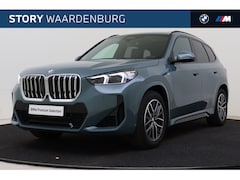 BMW X1 - xDrive23i High Executive M Sport Automaat / Panoramadak / Trekhaak / Sportstoelen / Adapti