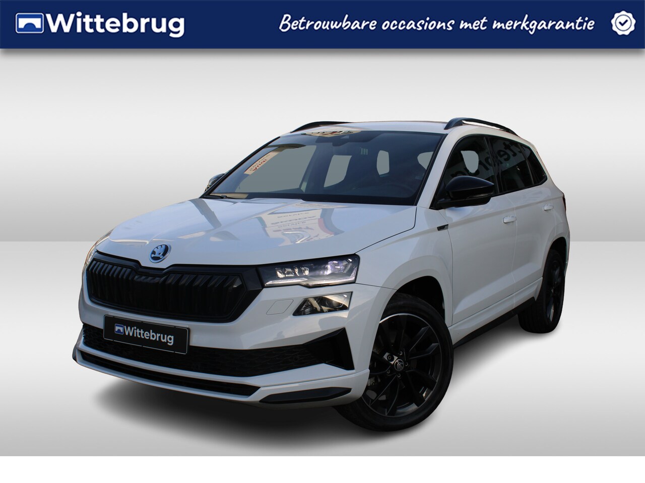 Skoda Karoq - 1.5 TSI ACT 150pk Sportline DSG Automaat / Navigatie / LM 18 inch / Parkeersensoren / Came - AutoWereld.nl