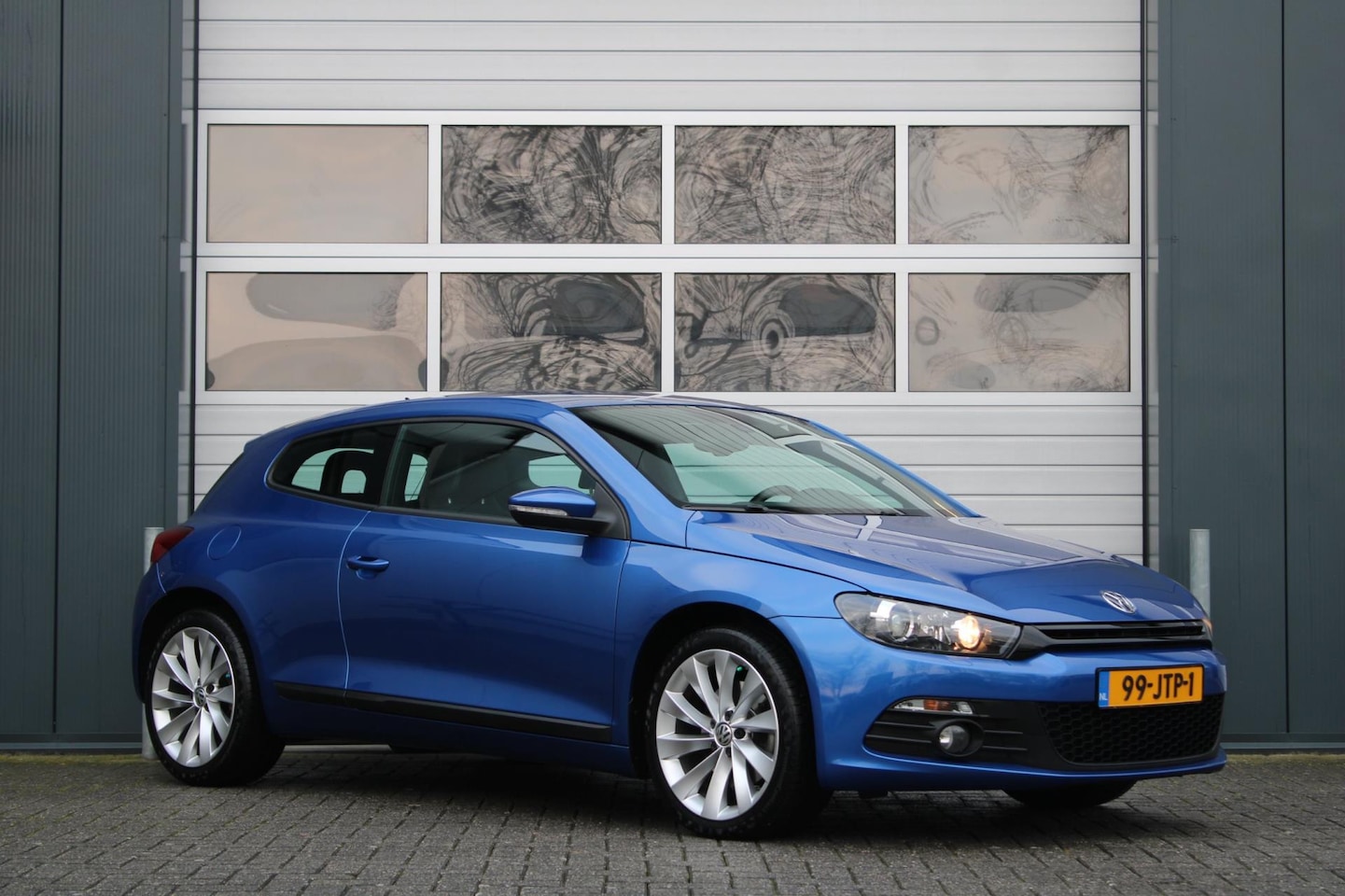 Volkswagen Scirocco - 1.4 TSI DSG 161pk Clima/Cruise/Stoelverwarming/Bi-Xenon/PDC/Leder/RadioCD.AUX/18"LM/GoedOn - AutoWereld.nl