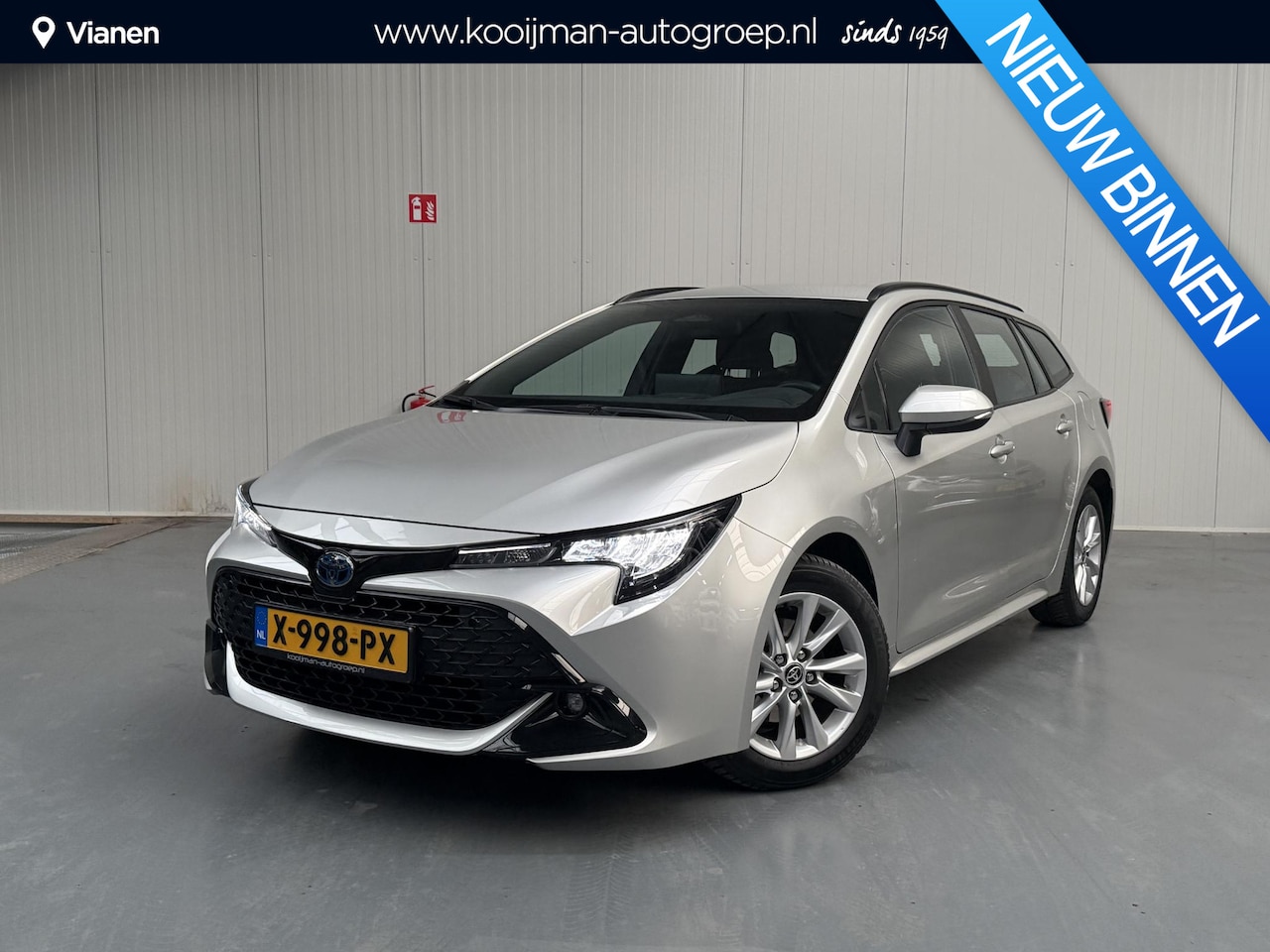 Toyota Corolla Touring Sports - Hybrid 140 Active met 4 nieuwe all season - AutoWereld.nl