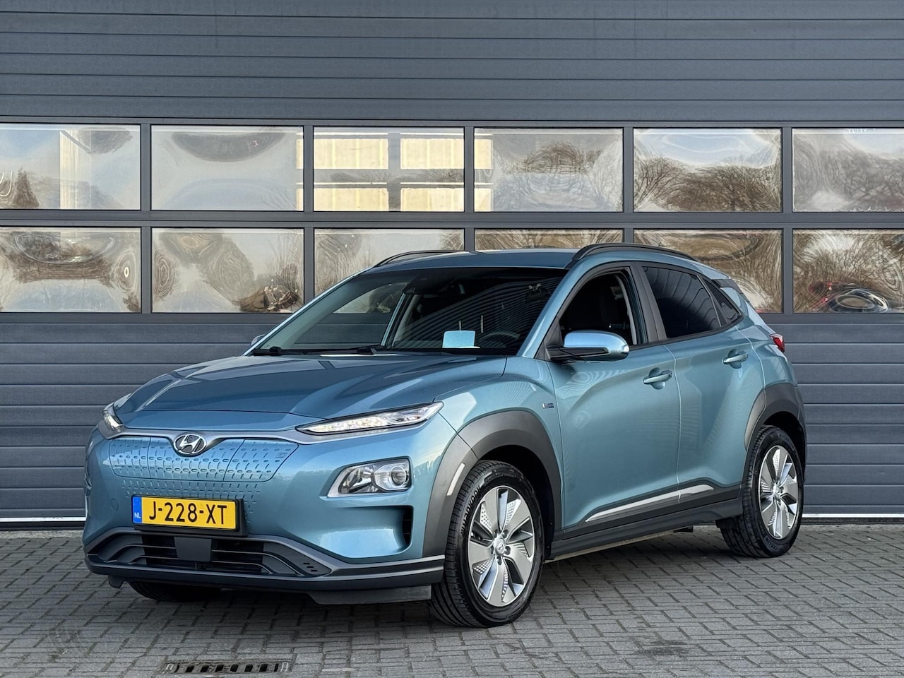 Hyundai Kona Electric - EV FASHION 64 KWH I 3 FASE I 100% SOH I P-CAMERA I AUTOMAAT I APPLE CARPLAY - AutoWereld.nl