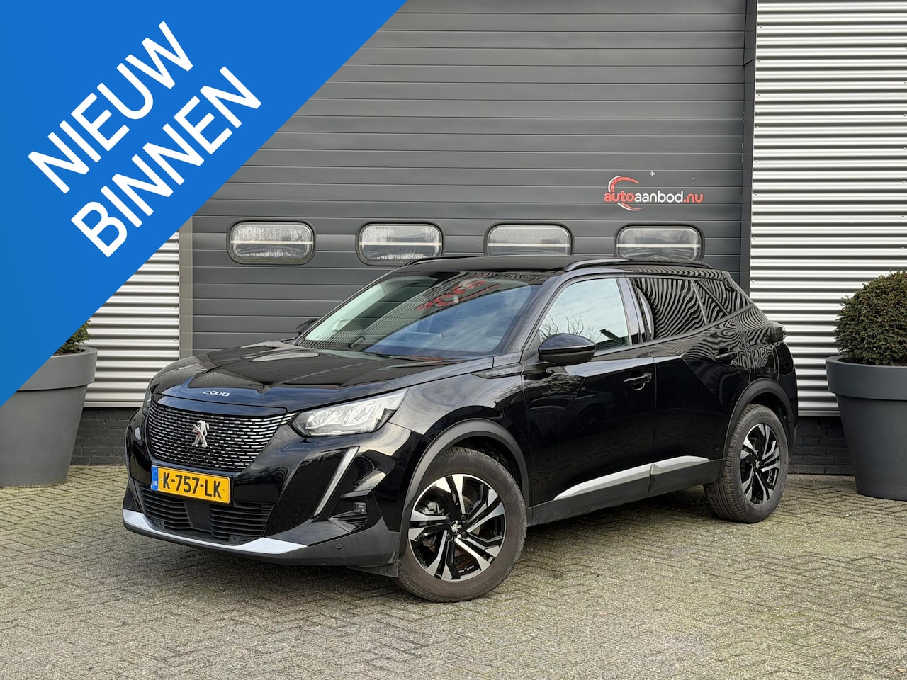 Peugeot 2008 - 1.2 PureTech Blue Lease Allure | Navigatie | Camera | Cruise Control | Climate Control | T - AutoWereld.nl