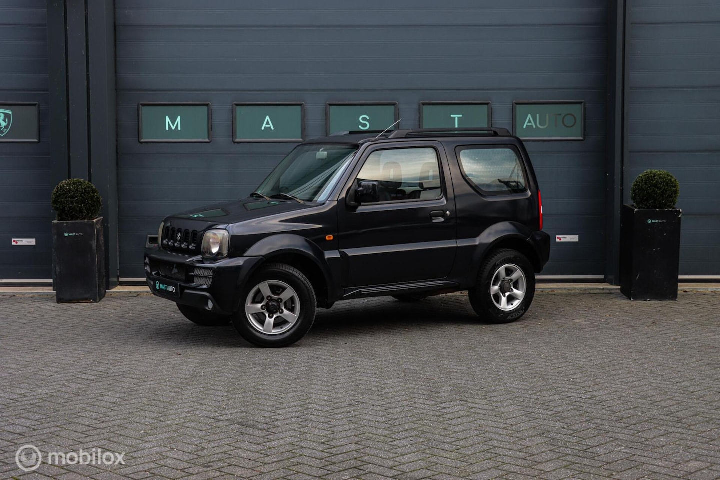 Suzuki Jimny - 1.3 Exclusive 4WD|Airco|NAP|Lichtmetalen velgen - AutoWereld.nl