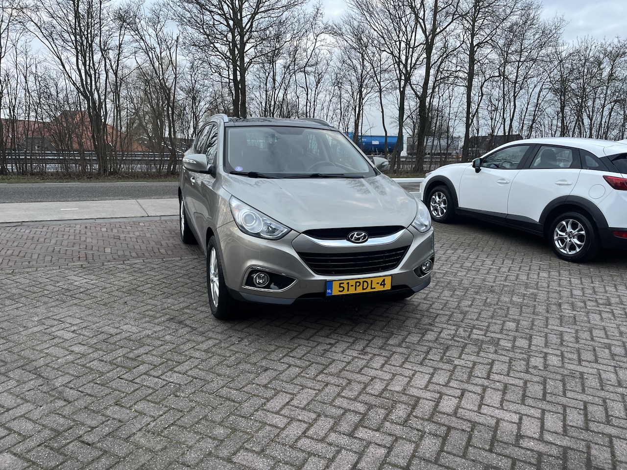 Hyundai ix35 - 2.0i i-Catcher OPEN DAK STOELVERWARMING V+A LEER CAMERA NAVI - AutoWereld.nl