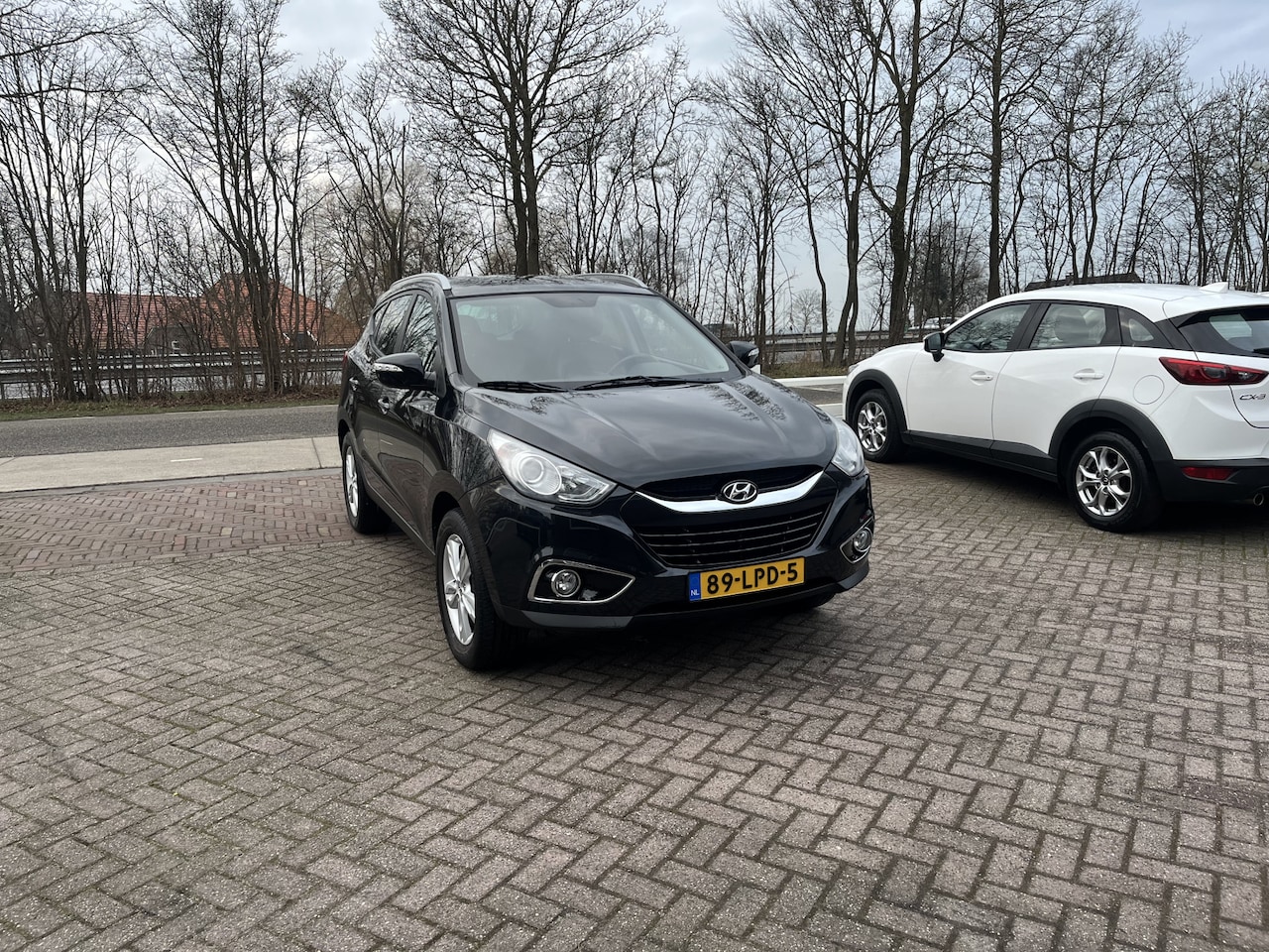Hyundai ix35 - 2.0i Business Edition TREKHAAK CRUISE NAVI CAMERA CLIMA - AutoWereld.nl