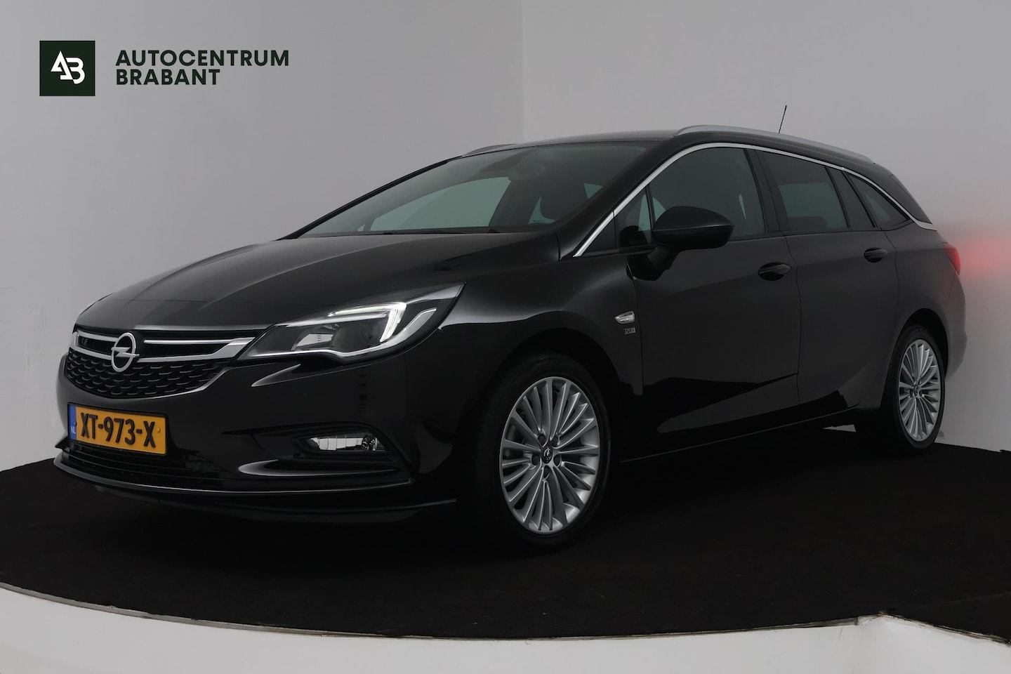 Opel Astra Sports Tourer - 1.4 Turbo 120 Jaar Edition (TREKHAAK, PARKEERSENSOREN, CRUISE CONTROL, NAVIGATIE) - AutoWereld.nl