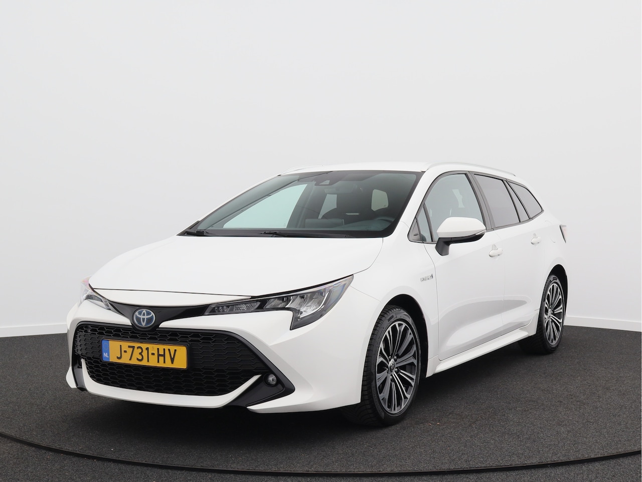 Toyota Corolla Touring Sports - 1.8 Hybrid Business Plus/ trekhaak/ lage km! - AutoWereld.nl