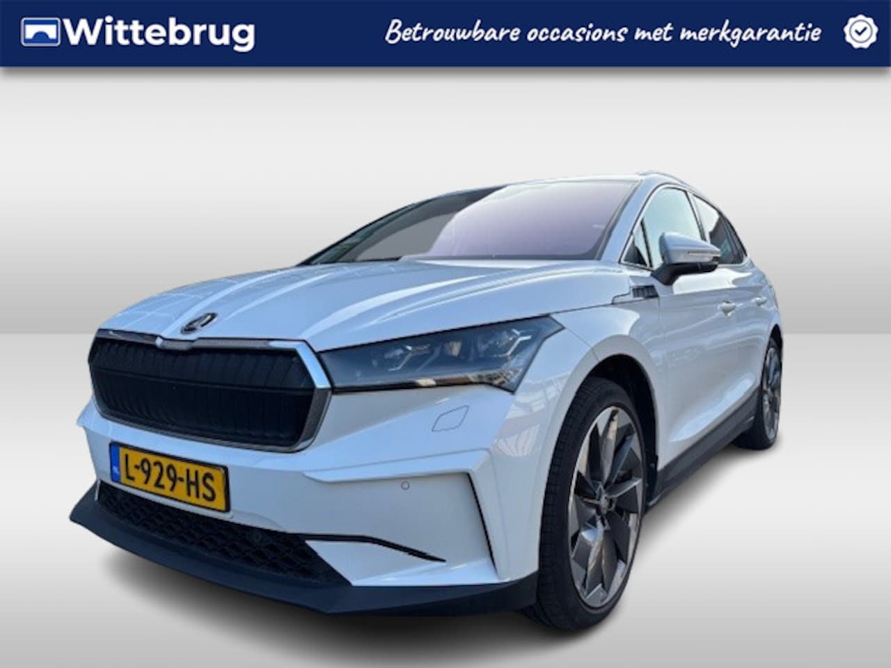 Skoda Enyaq iV - 80 First Edition Lederen interieur / Camera / Trekhaak / El verstelbare zetel / Navigatie - AutoWereld.nl