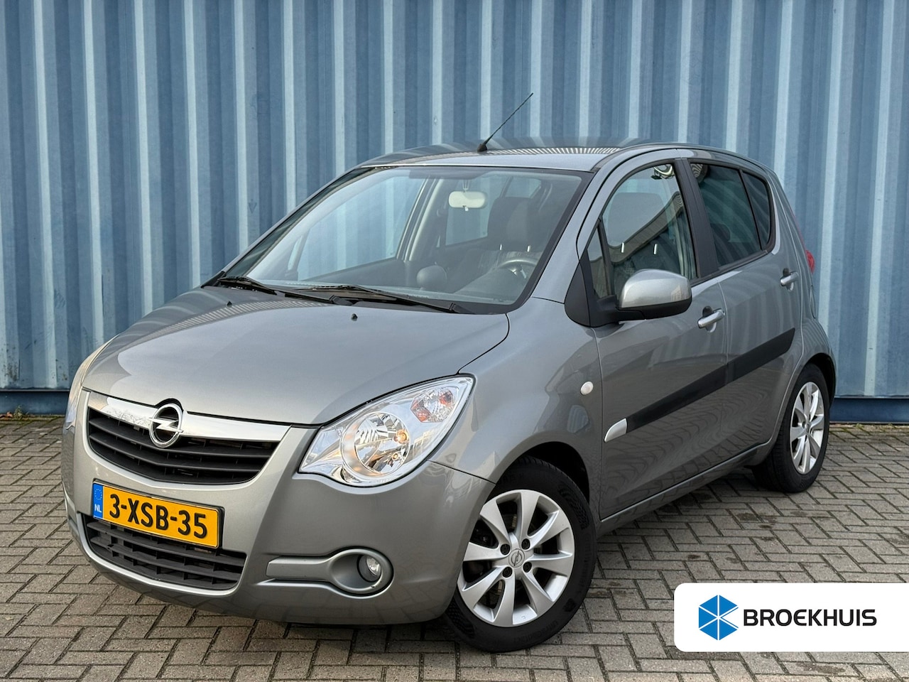 Opel Agila - 1.2 Edition Automaat | Parkeersensoren achter | Airco | Trekhaak | Lichtmetalen velgen | D - AutoWereld.nl