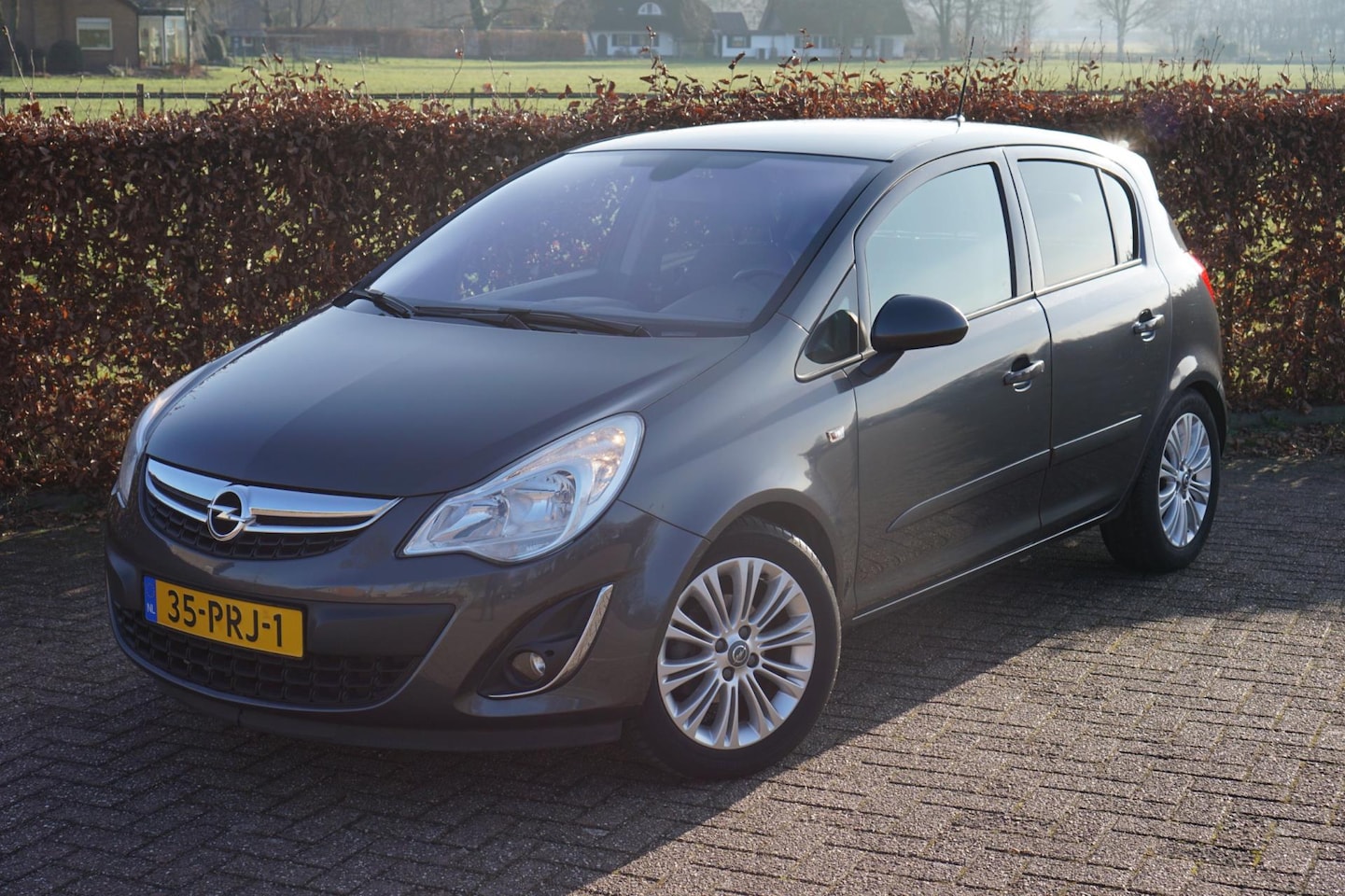 Opel Corsa - 1.4-16V Cosmo|1e Eigenaar|Volledige Historie|Navi - AutoWereld.nl