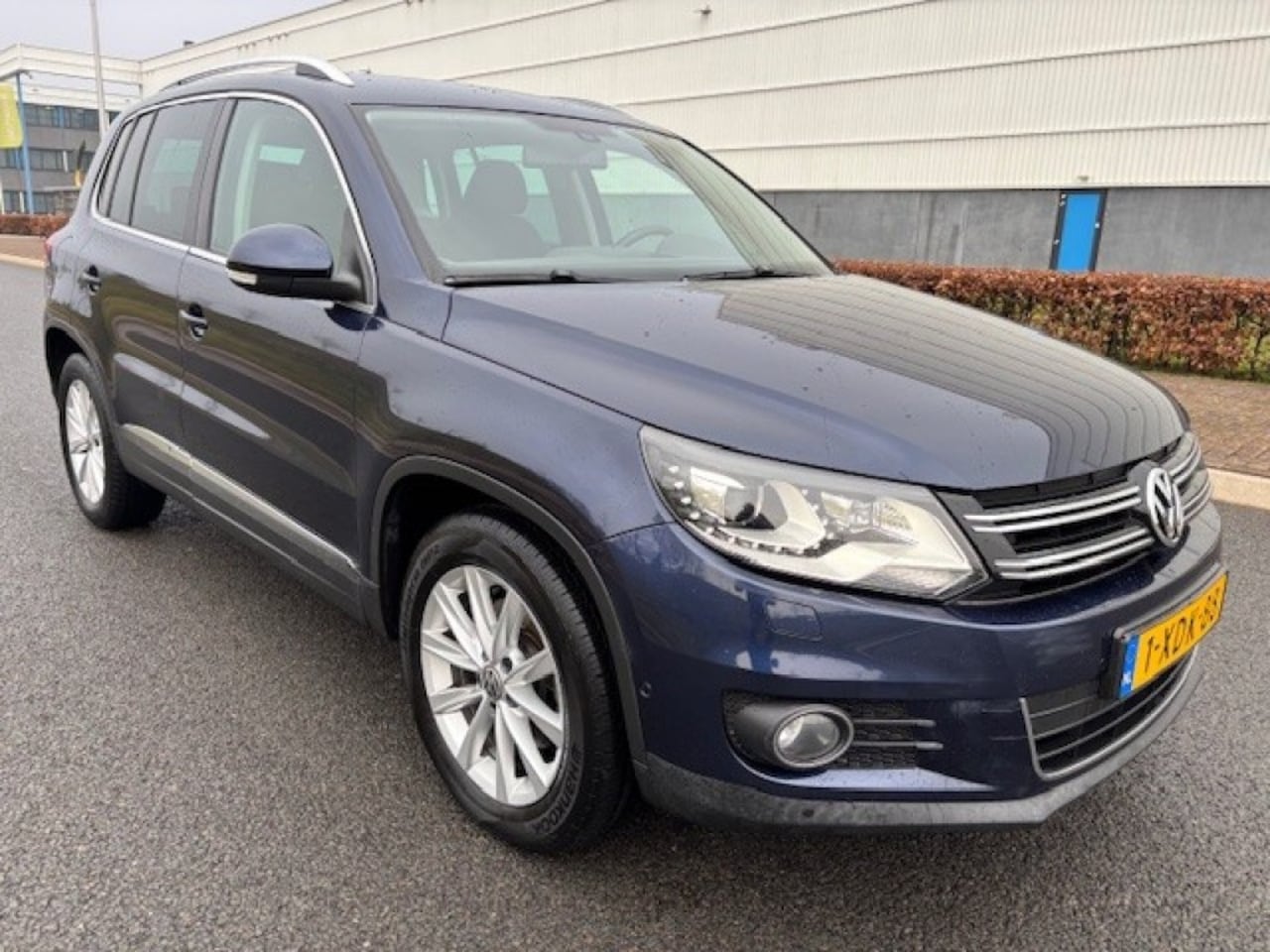 Volkswagen Tiguan - 1.4 TSI SPORTenSTYLE  AUT - AutoWereld.nl