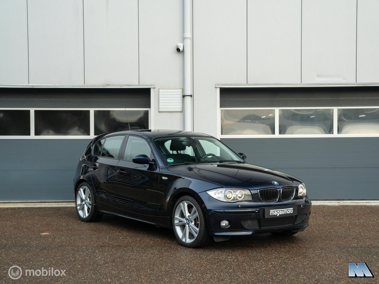 BMW 1-serie - 130i l AUT l 84.148 km l Monaco Blau - AutoWereld.nl