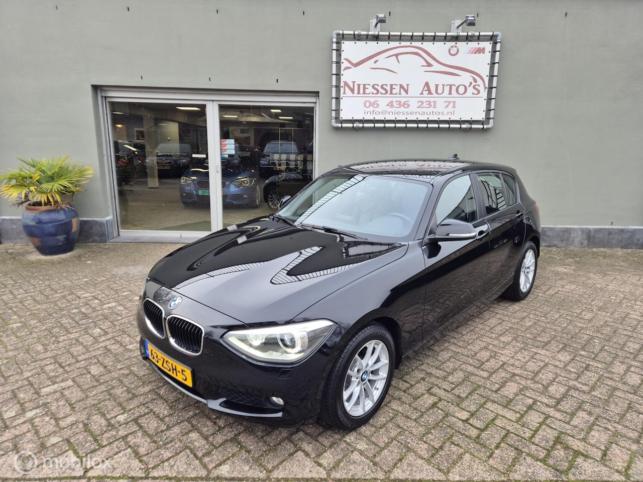 BMW 1-serie - F20 114i EDE Business+ Leder/Led/Navi/Trekhaak - AutoWereld.nl