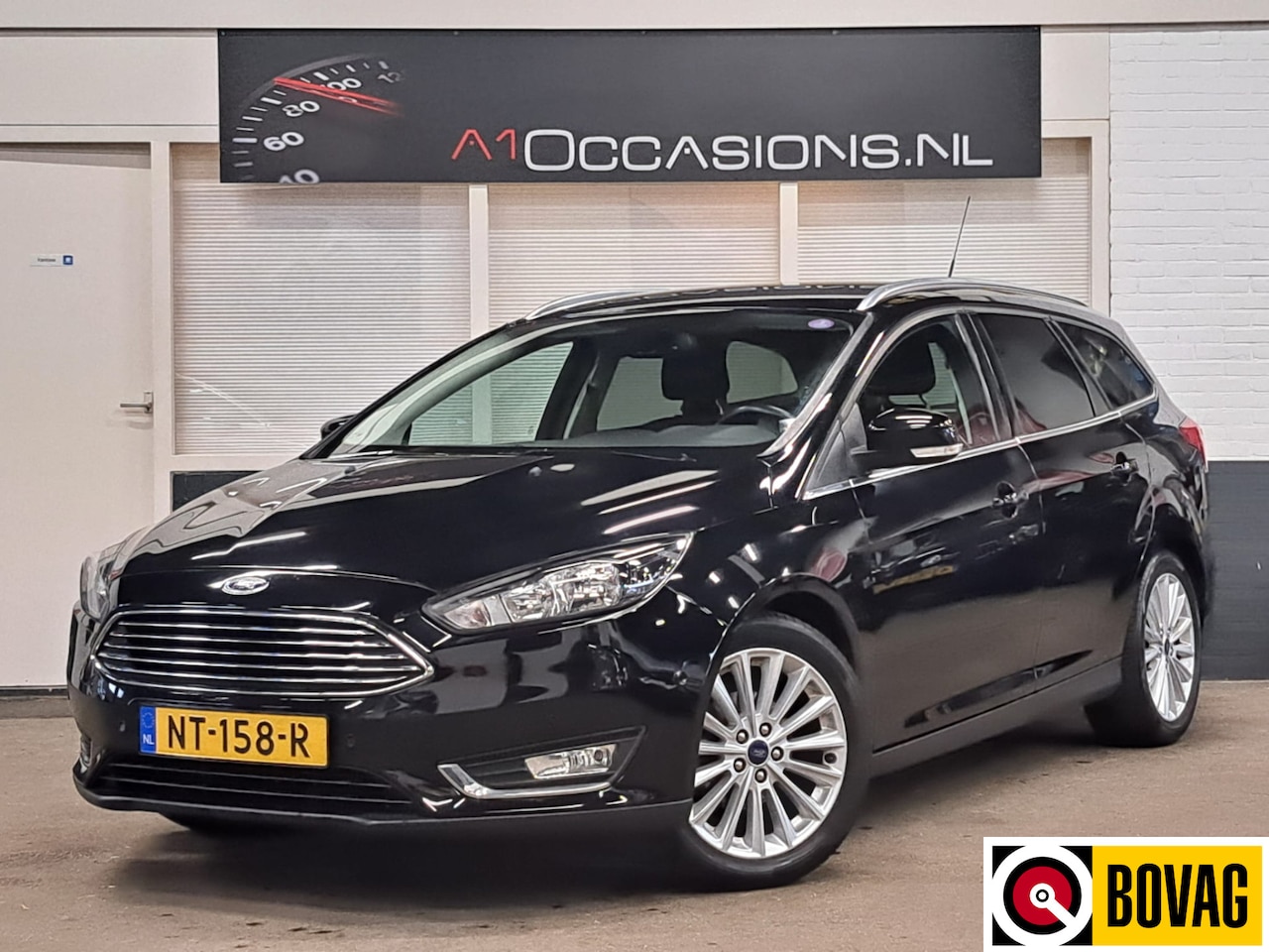 Ford Focus Wagon - 1.0 Titanium +NAVI - AutoWereld.nl