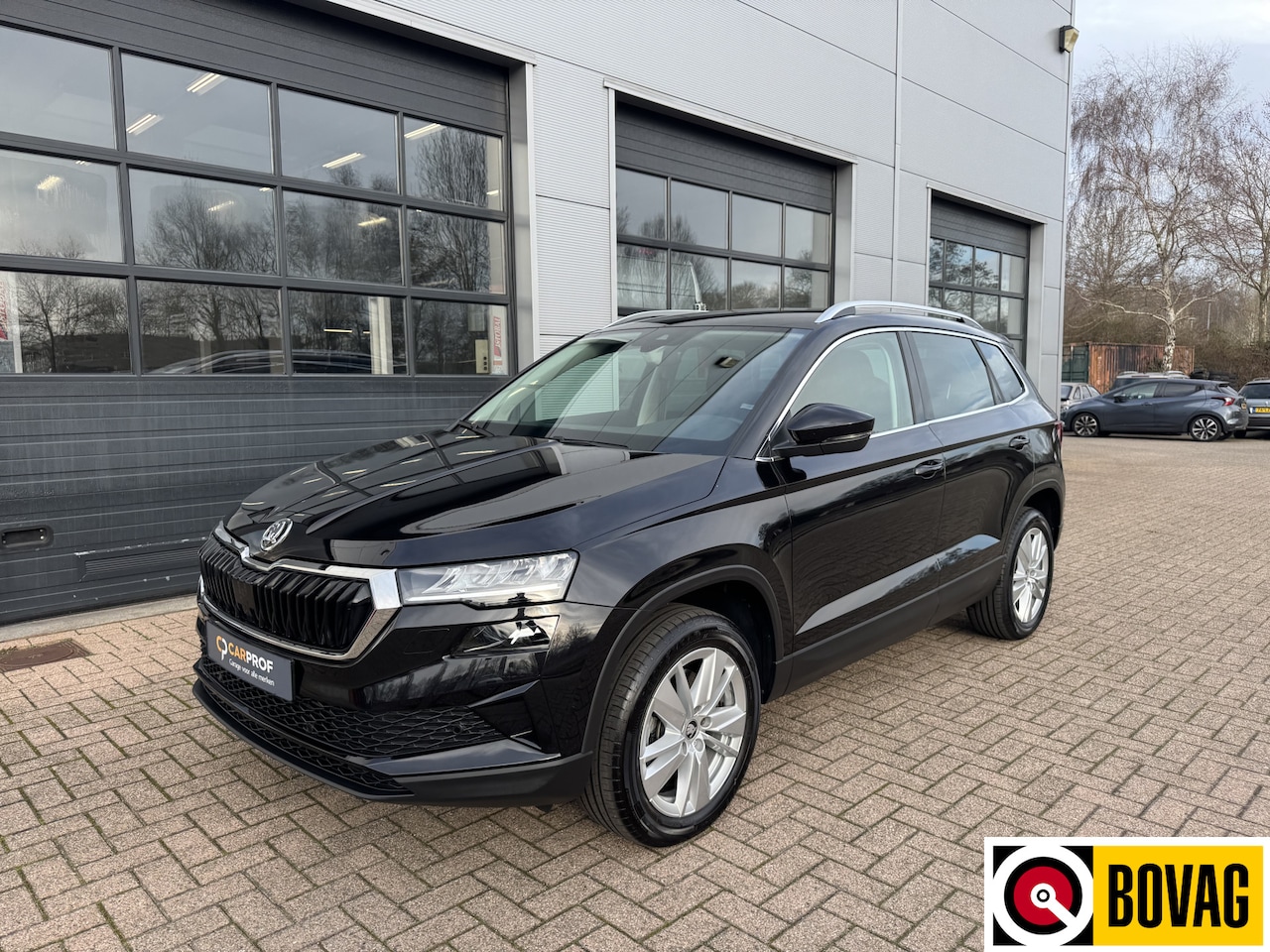 Skoda Karoq - 1.5 TSI ACT Business Edition Plus | Trekhaak wegklapbaar |Stoelverwerming/stuurverwarming - AutoWereld.nl
