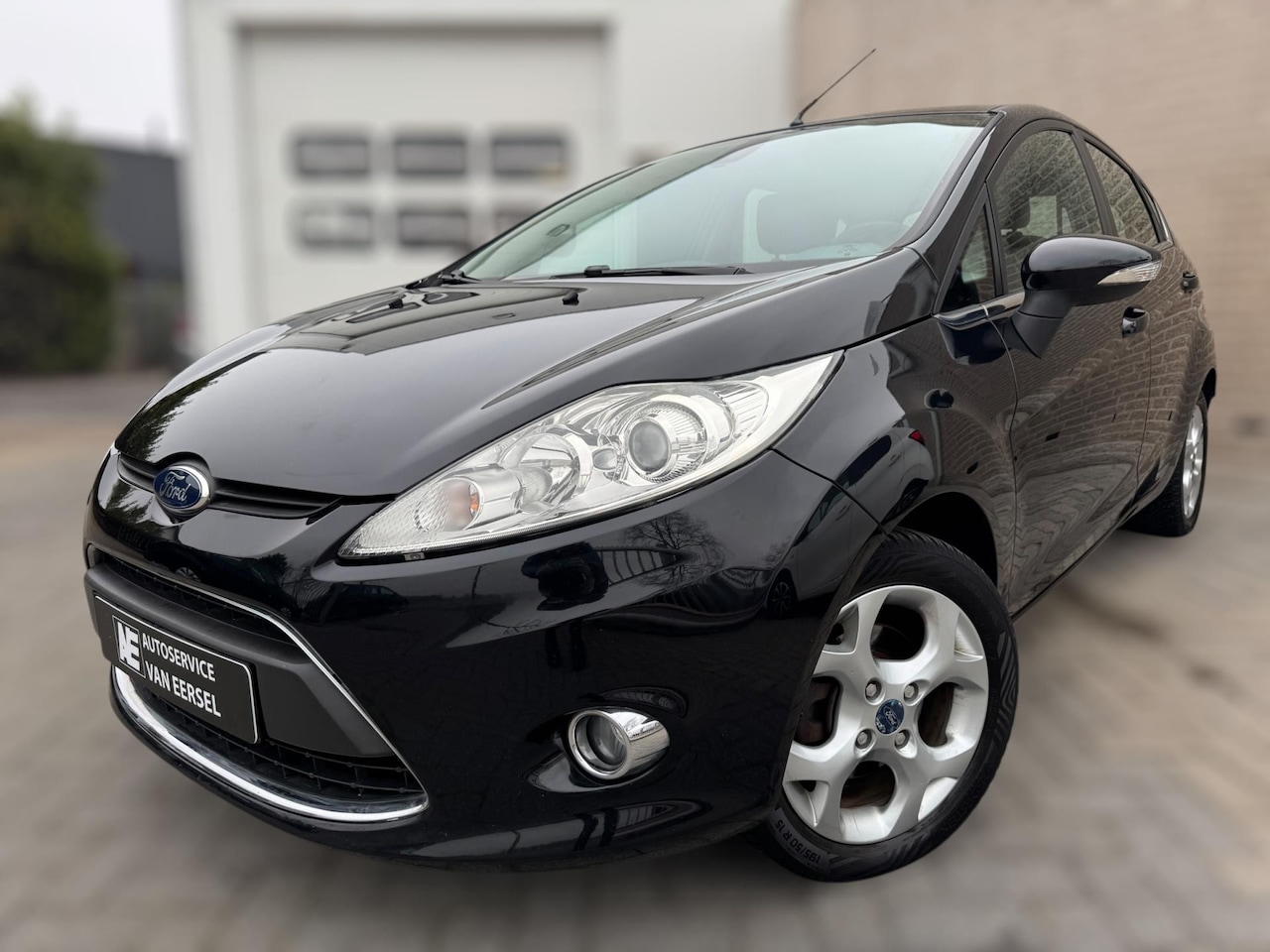 Ford Fiesta - 1.4 Titanium PDC / CRUISE / BLUETOOTH / WINTERPACK / LMV / ECC / ELEKTR. INKLAPB SPIEGELS - AutoWereld.nl