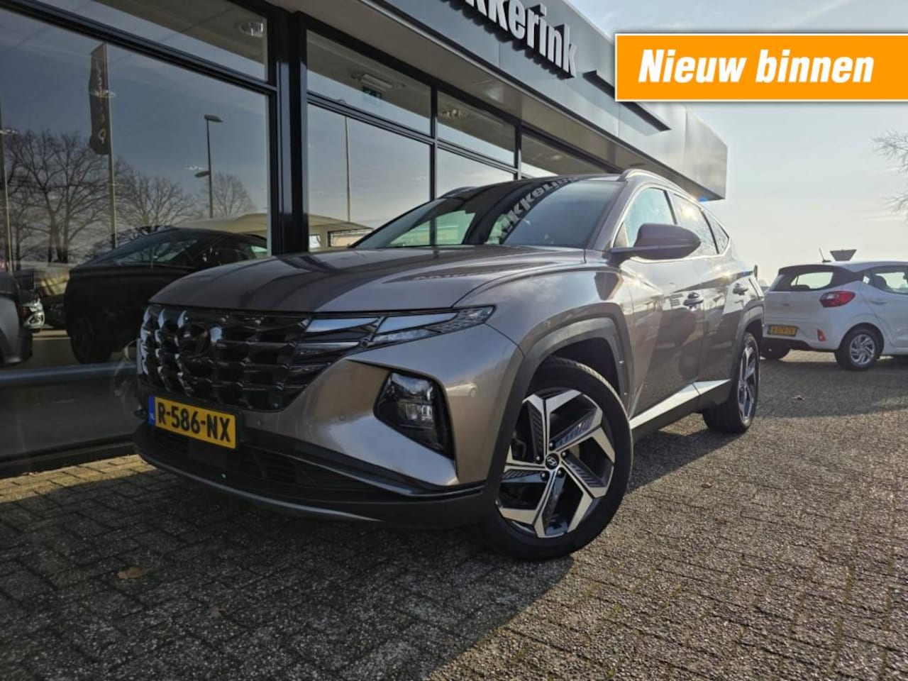 Hyundai Tucson - 1.6 T-GDI HEV PREMIUM/TREKHAAK/360CAMERA - AutoWereld.nl