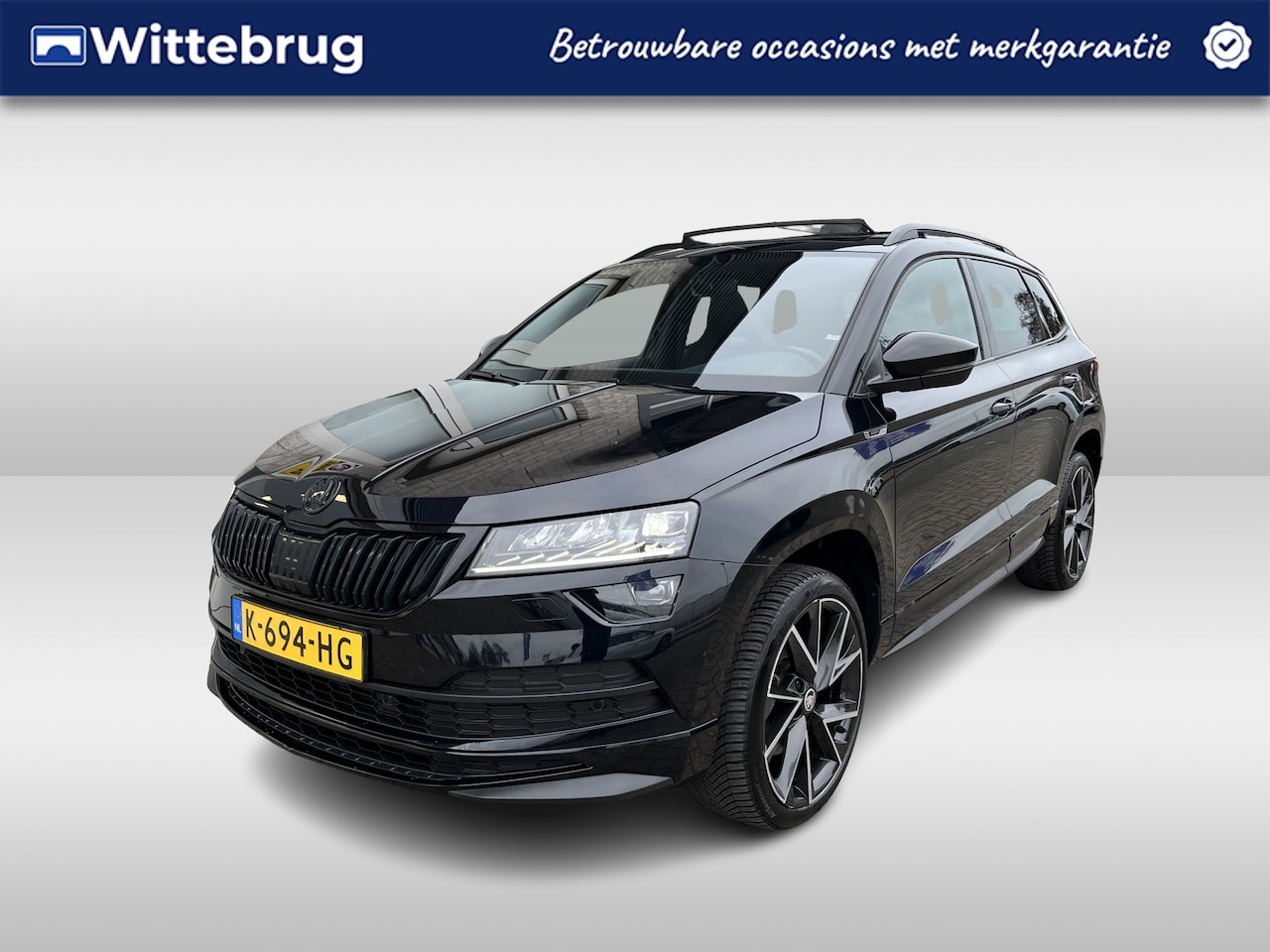 Skoda Karoq - 1.5 TSI ACT Sportline Business / PANO/ STOEL-STUURVERWARM./ CAMERA/ PARK. SENSOREN/ CRUISE - AutoWereld.nl