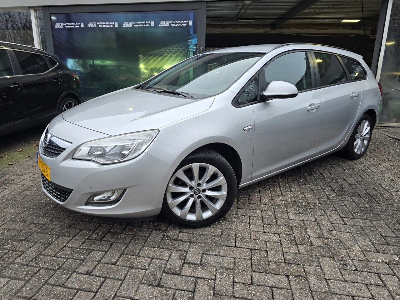 Opel Astra Sports Tourer - 1.4 Anniversary Edition | 2E EIGENAAR | 12MND GARANTIE | AIRCO | NAVI | CRUISE | - AutoWereld.nl