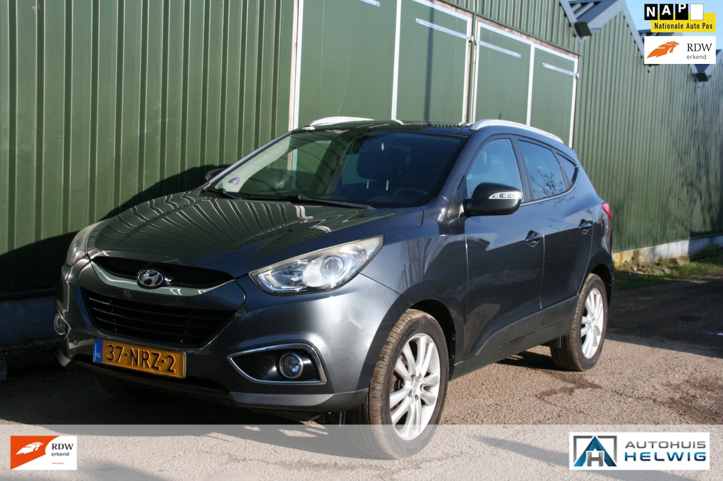 Hyundai ix35 - 2.0i i-Catcher 2.0i i-Catcher, LEER, NAVIGATIE, AIRCO, TREKHAAK, GLAZEN DAK - AutoWereld.nl