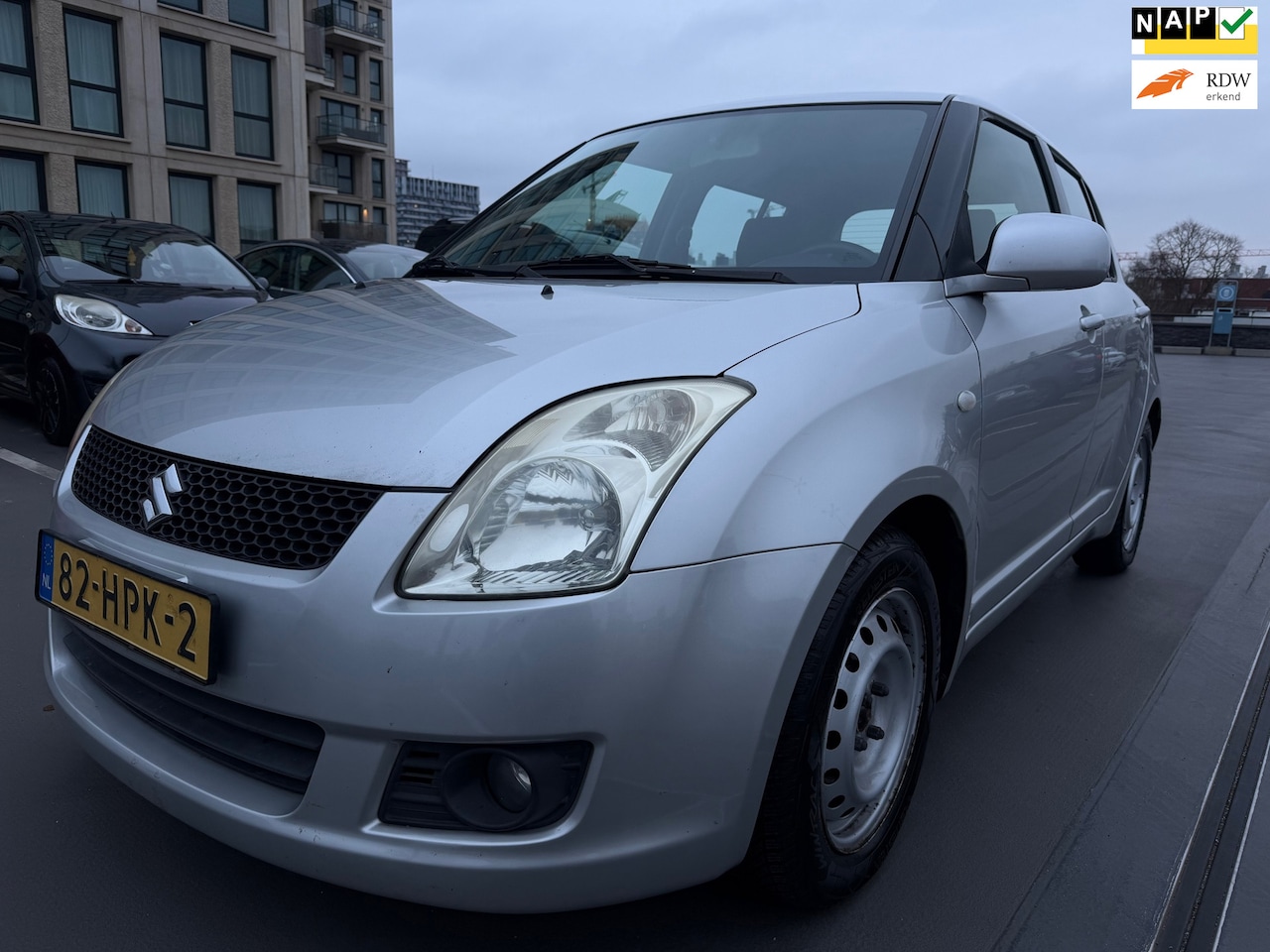 Suzuki Swift - 1.3 Shogun airco CarPlay camera Navi nette auto - AutoWereld.nl