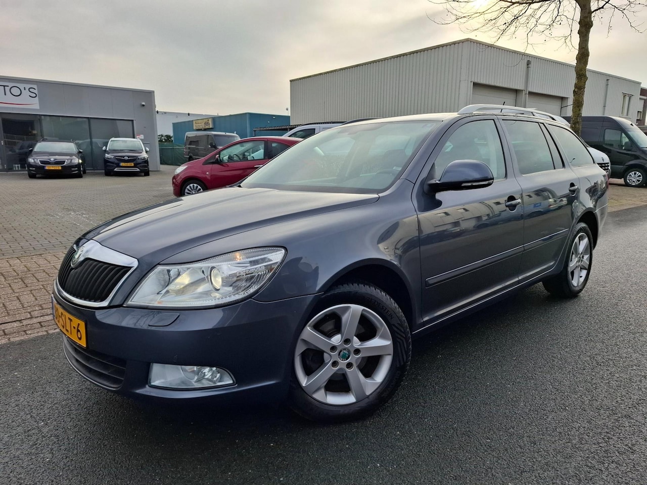 Skoda Octavia Combi - 1.2 TSI Elegance Business Line CLIMA/CRUISE/NAVI/XENON! - AutoWereld.nl