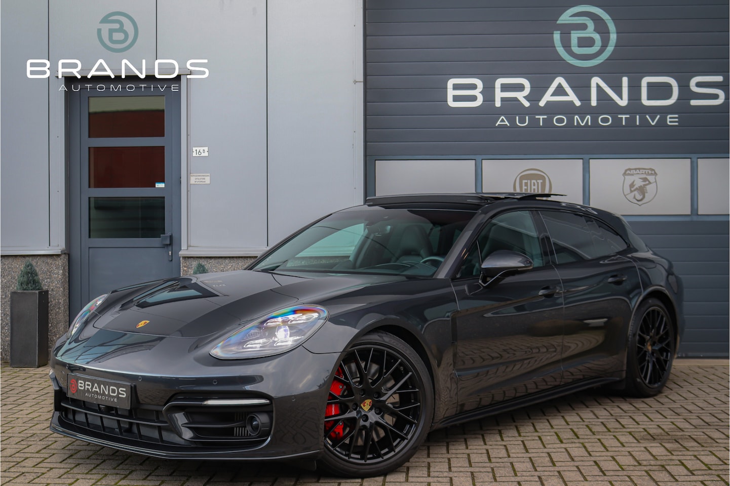 Porsche Panamera Sport Turismo - 2.9 4S Hybrid RWS Soft close Pano HUD Vol opties Approved - AutoWereld.nl