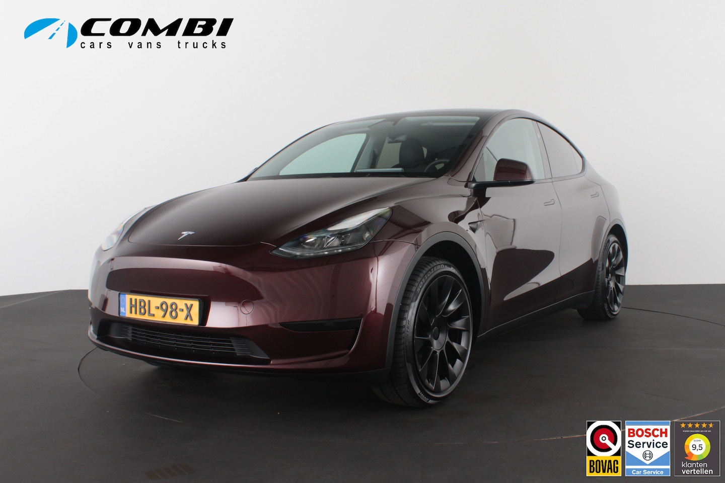 Tesla Model Y - RWD 58 kWh Midnight Cherry Red/20inch/Trekhaak/Premium interieur - AutoWereld.nl