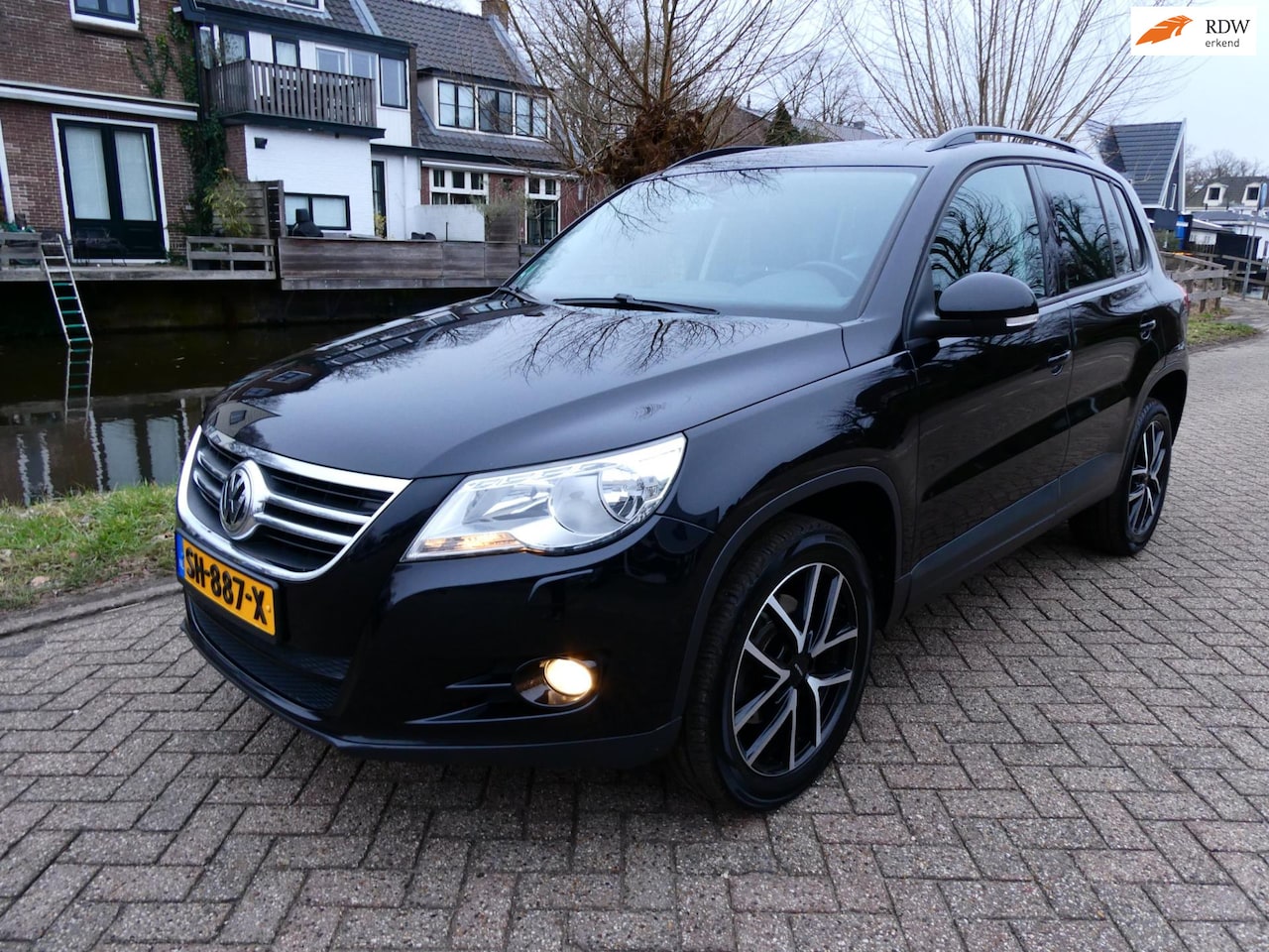Volkswagen Tiguan - 1.4 TSI Easyline 122pk Clima Cruise Navi Trekhaak 1600kg. - AutoWereld.nl