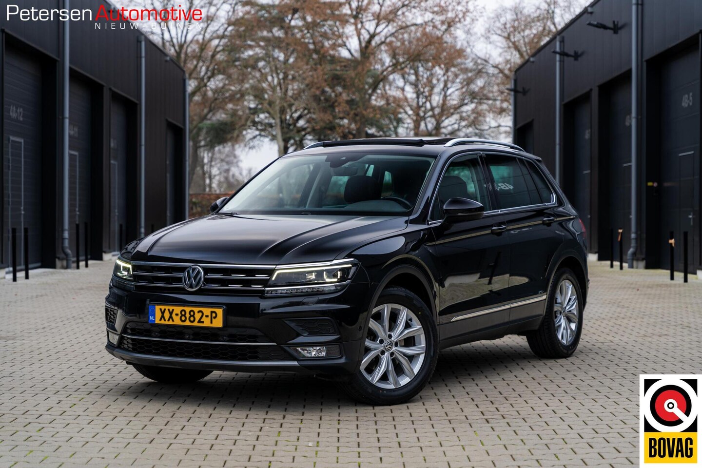 Volkswagen Tiguan - 1.4 TSI 4Motion Highline *Vol* Leder* Pano* - AutoWereld.nl