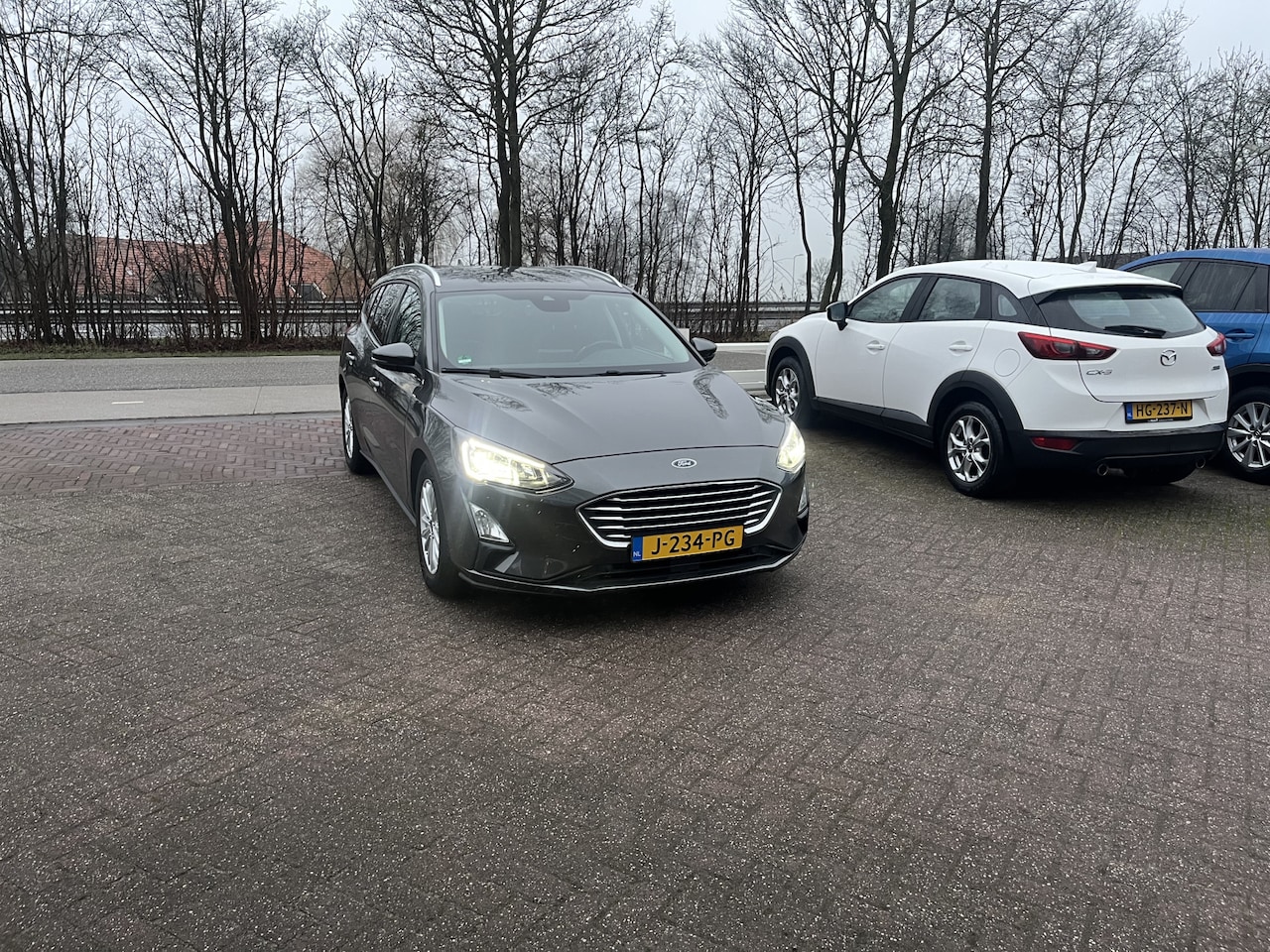 Ford Focus Wagon - 1.0 EcoBoost Hybrid Titanium X Business TREKHAAK CAMERA CLIMA NAVI - AutoWereld.nl