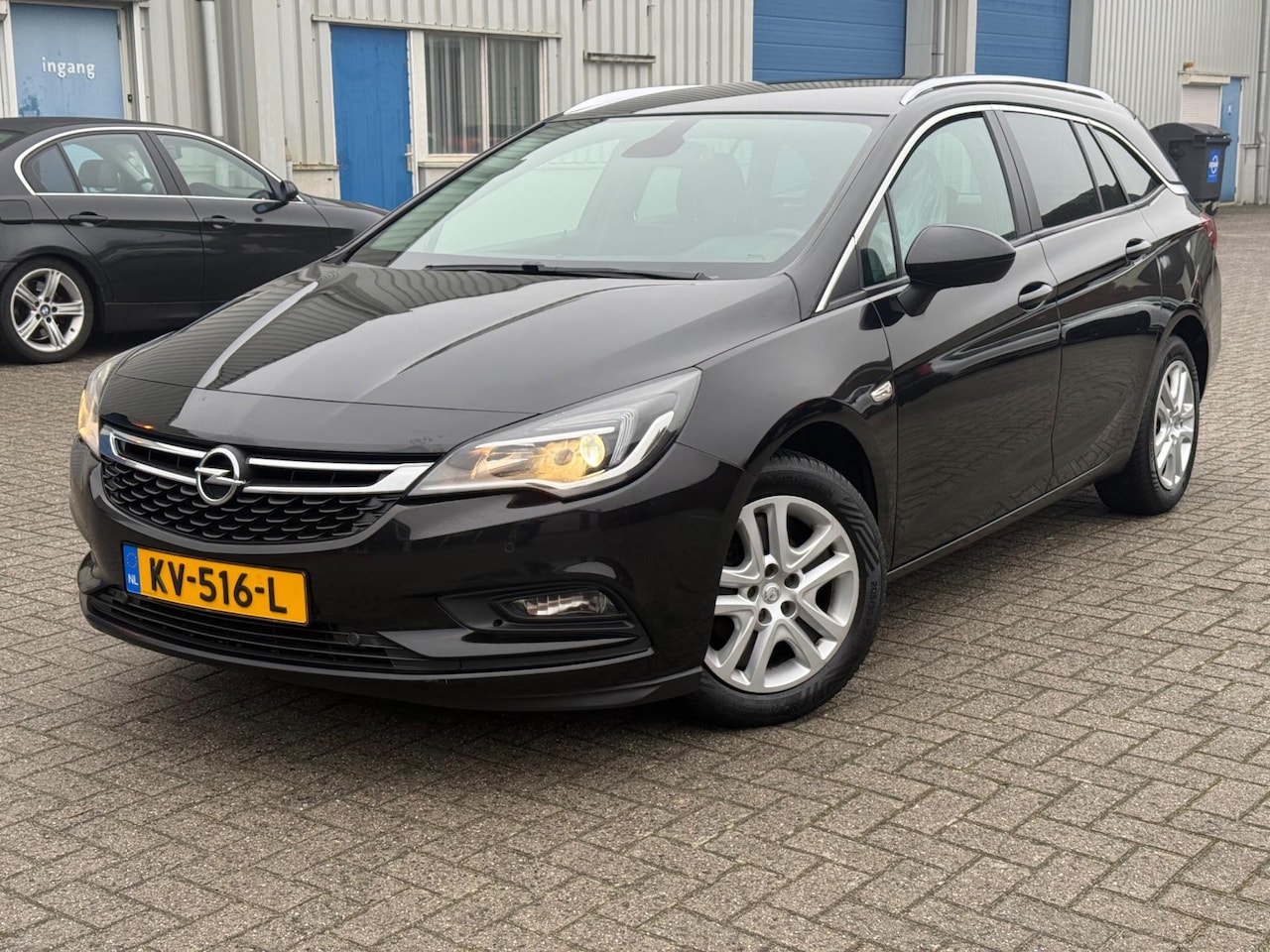 Opel Astra Sports Tourer - 1.4 Business+/Clima/Cruise/Navi/PDC/NAP/Trekhaak - AutoWereld.nl