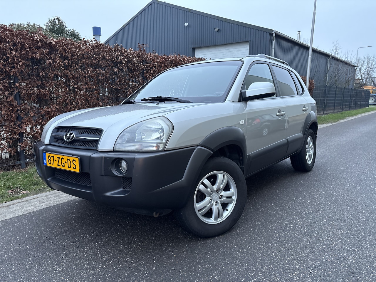 Hyundai Tucson - 2.0i Style / AIRCO ECC / NAVI / CRUISE - AutoWereld.nl