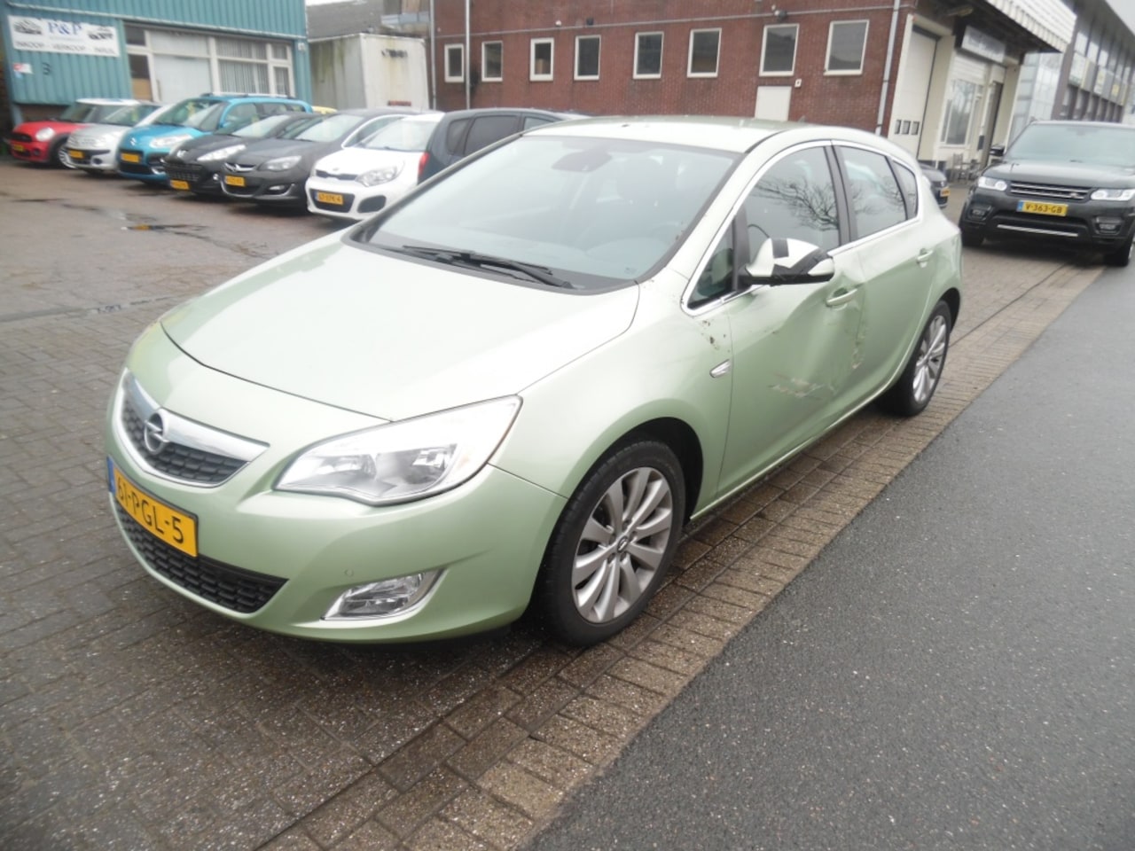 Opel Astra - lichte schade 1.4 Turbo Cosmo airco navi - AutoWereld.nl