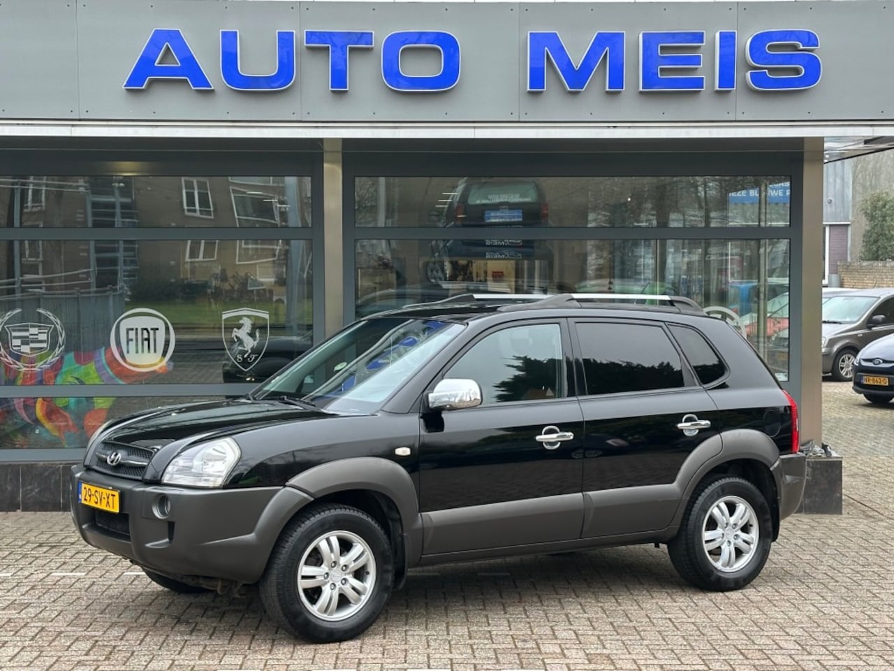 Hyundai Tucson - 2.0I STYLE W.CUP ED. Airco Cruise Trekhaak LEER - AutoWereld.nl