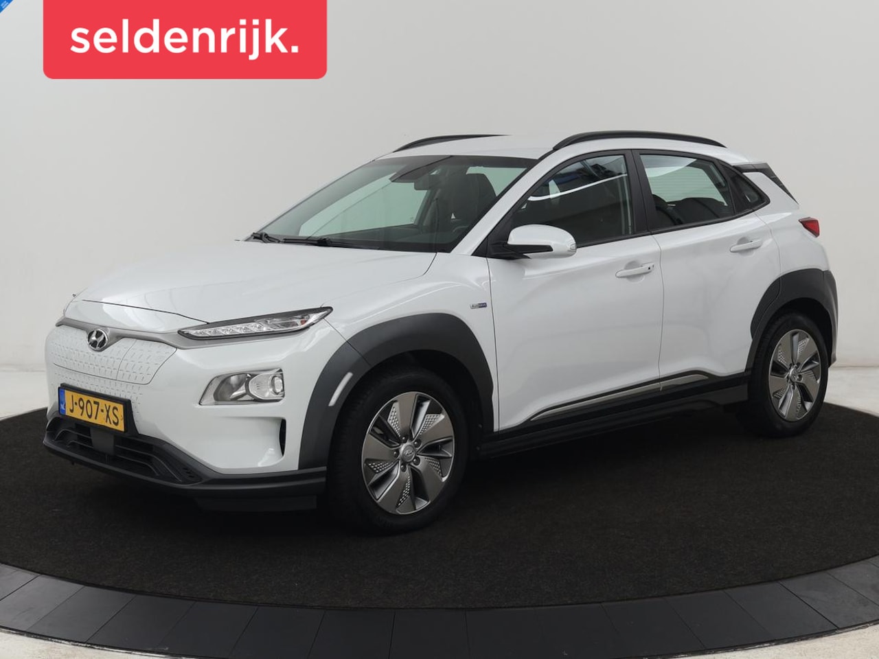 Hyundai Kona Electric - EV Comfort 64 kWh | Trekhaak | Adaptive cruise | Warmtepomp | Camera | Carplay | Keyless | - AutoWereld.nl