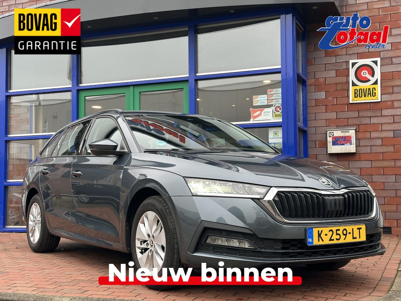 Skoda Octavia Combi - 1.0 TSI Business Edition | Navi | Sensoren | Elektrische klep - AutoWereld.nl