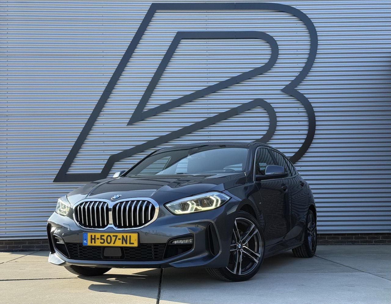 BMW 1-serie - 118i High Executive Edition M-Pakket,2e Eigenaar,Navi,Leder,Stoelverwarming,PDC,N.A,P,APK - AutoWereld.nl