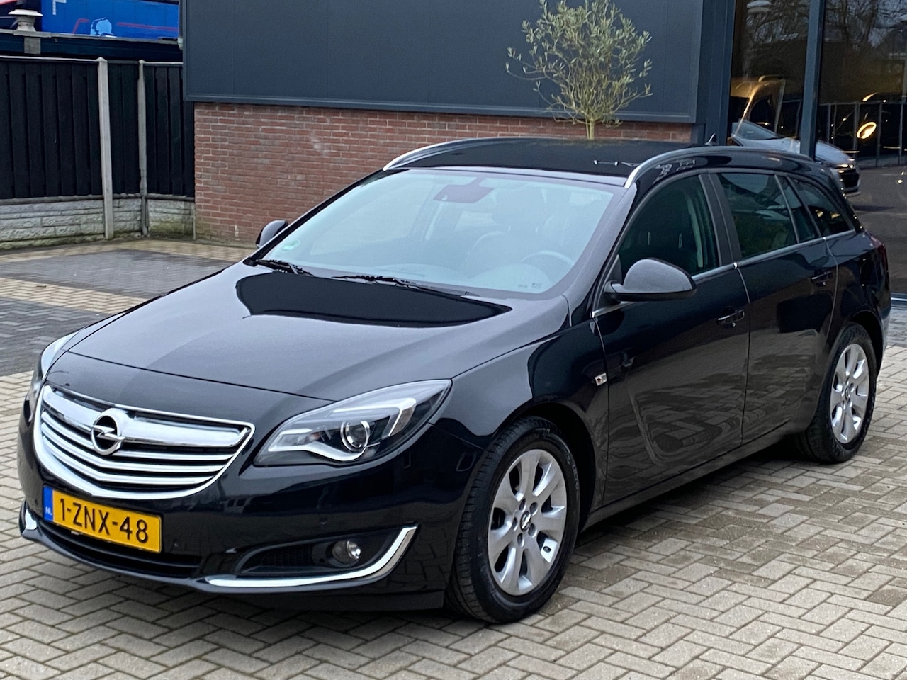 Opel Insignia Sports Tourer - 1.4 T Business+ NIEUWSTAAT LEER NAVI CRUISE XENON PDC CLIMA TREKHAAK - AutoWereld.nl