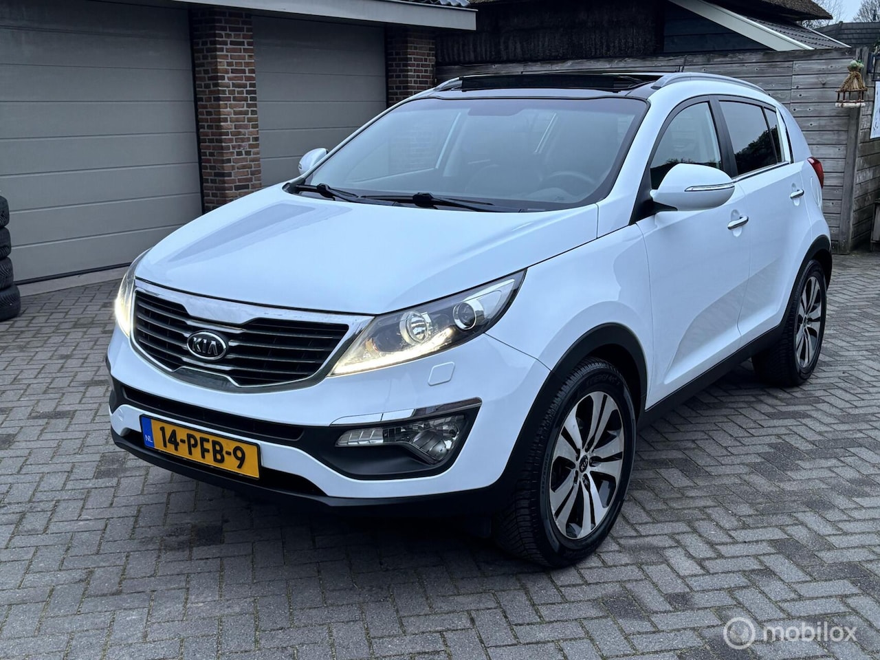 Kia Sportage - 2.0 X-clusive Automaat - AutoWereld.nl