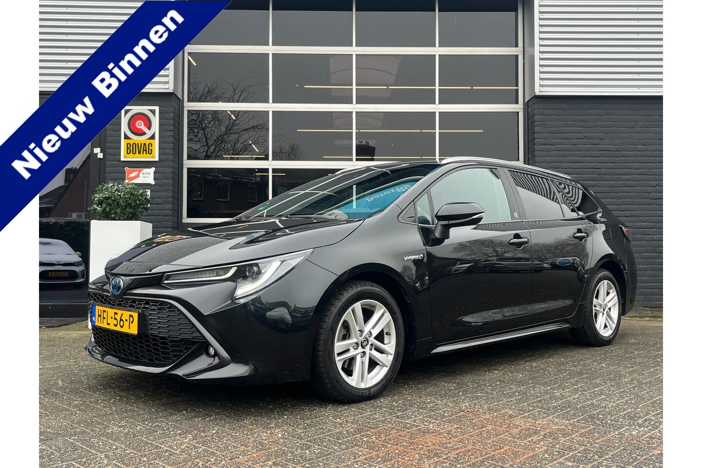 Toyota Corolla Touring Sports - 1.8 Hybrid Business Plus 1.8 Hybrid Business Plus, Automaat, Cruise, Camera, Stuurverwarming - AutoWereld.nl