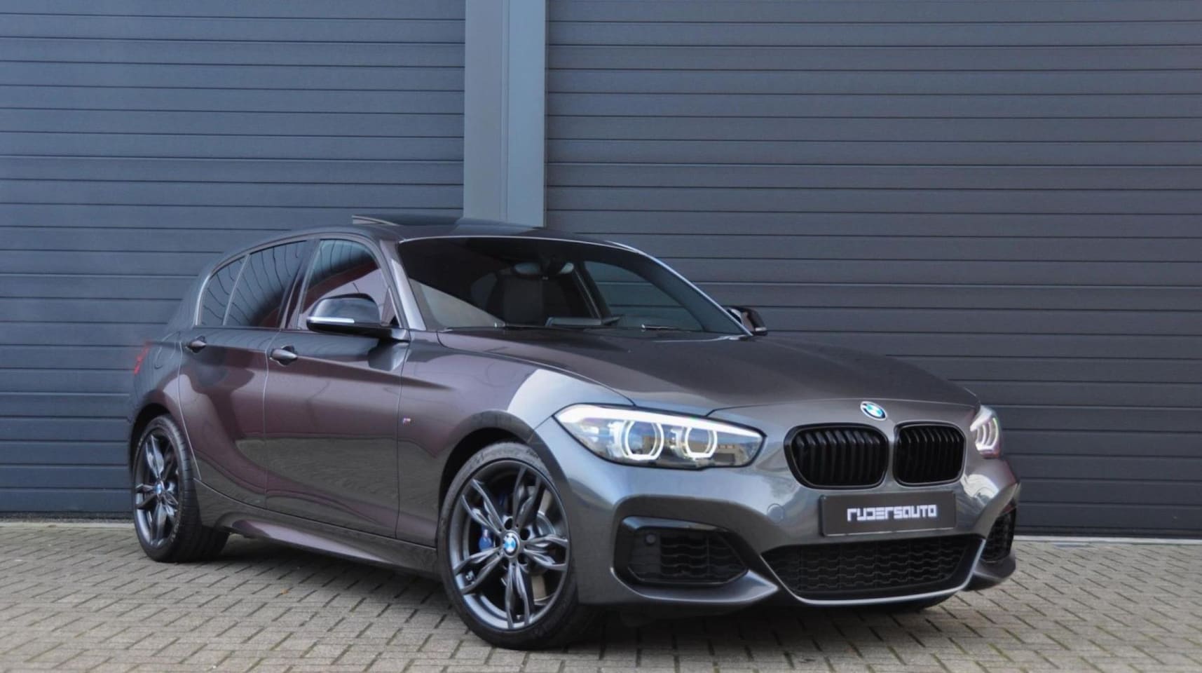 BMW 1-serie - M140i LCI2 | Schuifdak | HK | Akrapovic | Zaero diffuser | M Sport onderstel - AutoWereld.nl