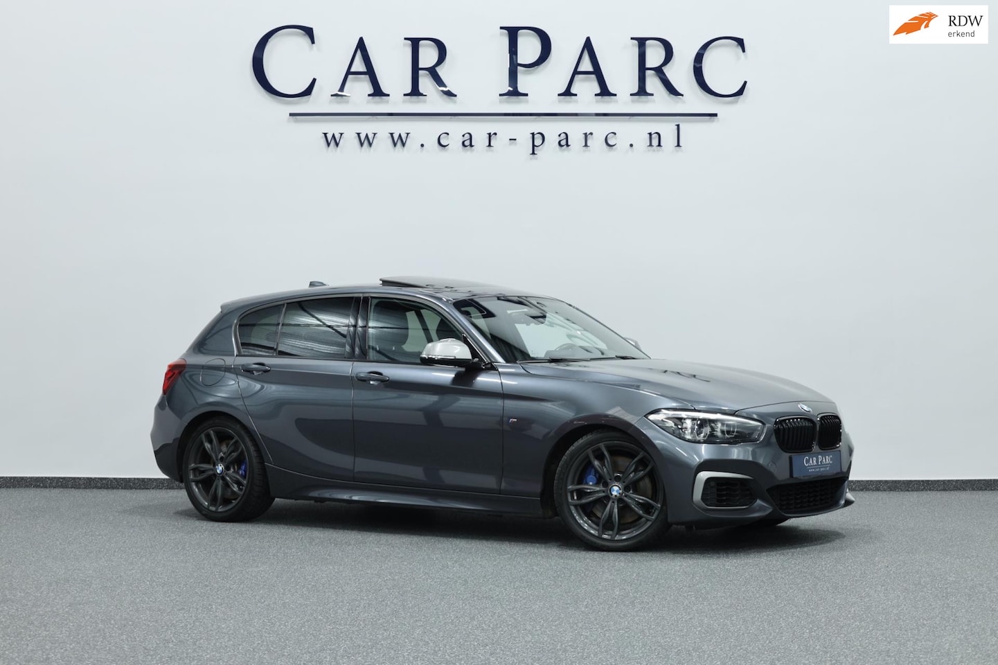 BMW 1-serie - M140i Special Edition LED/SCHUIFDAK/LEER+S.VERWARMING/LMV/PDC/CRUISE/ECC/12 MND GARANTIE! - AutoWereld.nl