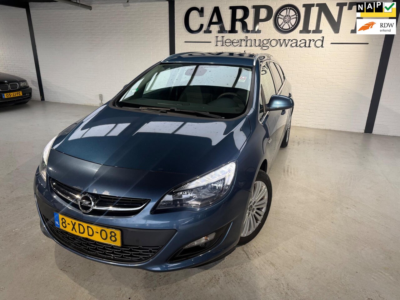 Opel Astra Sports Tourer - 1.4 Turbo Design Edition 2014 Camera Navi Half Leder Clima Cruise - AutoWereld.nl