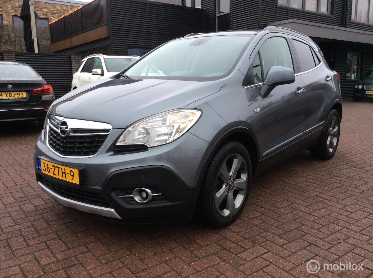 Opel Mokka - 1.6 Cosmo 18" Lederen bekl Nav Trekh Nap Camera - AutoWereld.nl
